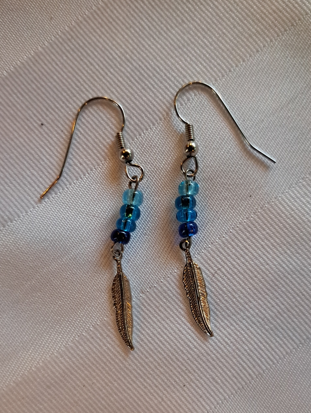 Silver Feather Drop Earrings with Blue Beads